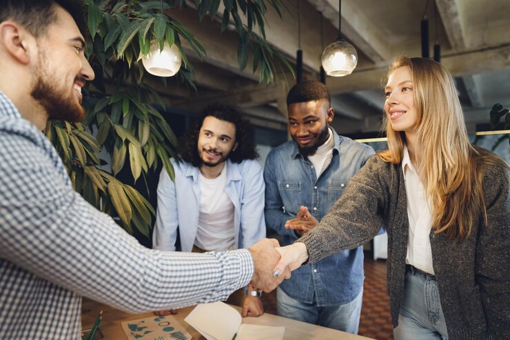 female office executive shaking hand new male team member employee_93675 134725